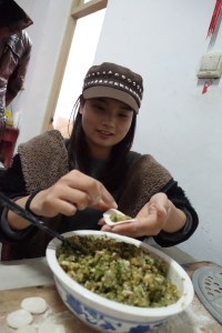 Preparing the traditional New's Day Breakfast with Dumplings (Jiaozi).